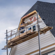 Vinyl shake siding installation on a house.